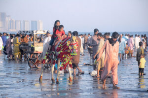 Children enjoying camel ride at sea view beach Clifton, on the 2nd day of Eid-ul-Fitr celebrations