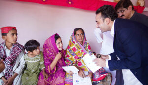 Chairman Pakistan Peoples’ Party Bilawal Bhutto Zardari distribute documents to flood affectees during his visit for Land titles distribution ceremony under construction of Sindh People's Housing for flood affectees at Gul Hasn village.