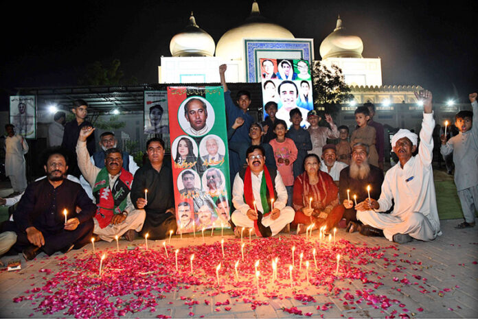Pakistan People’s Party workers attending the candle lit up ceremony in front of the mausoleum of Shaheed Zulfiqar Ali Bhutto to pay tribute on his 46th martyrdom anniversary at Garhi Khuda Bakhsh