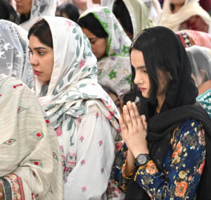 Christians worship at Don Bosco Church during Good Friday prayers.