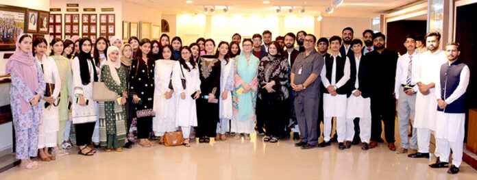 A group photo of students from National Defence University Islamabad dur