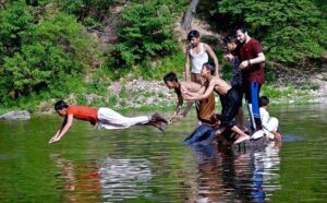 Teenagers swimming in the refreshing waters of Korang Nala to beat the heat in the heart of federal capital on a hot day.