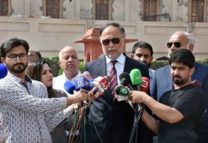 Minister for Planning Ahsan Iqbal speaks to the media during his visit to the mausoleum of Allama Muhammad Iqbal, Pakistan's national poet, on the occasion of his 87th death anniversary.