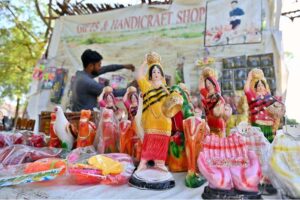 A vendor displaying handmade clay toys to attract children at Mohenjo-Daro