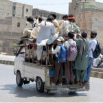 Large number of passengers traveling on rooftop of Suzuki at Jail Road needs the attention of concerned authorities