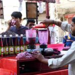 A vendor selling traditional summer drink at Pakistan Chowk during scorching hot weather in the city
