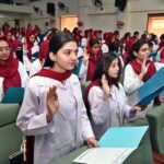 MBBS students take the oath during the White Coat oath taking Ceremony at Niazi Medical & Dental College, Sargodha