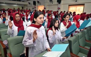 MBBS students take the oath during the White Coat oath taking Ceremony at Niazi Medical & Dental College, Sargodha