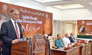 Minister for Planning Ahsan Iqbal speaks to the media during his visit to the mausoleum of Allama Muhammad Iqbal, Pakistan's national poet, on the occasion of his 87th death anniversary.