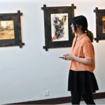 An art lover visits the art exhibition “Rekingdling: The Kalash Narrative,” by six accomplished artists, Ahmed Habib, Akram Dost Baloch, Ejaz Khan, M.A.Bhatti, Riffat Khattak and Samreen Asif organized by Pakistan National Council of the Arts in collaboration with Nomad Gallery at Gallery 06 in PNCA