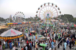 Children enjoying the mechanical swings during 3rd day of Eid-ul-Fitr celebrations at Funland