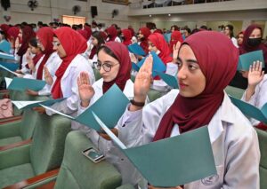 MBBS students take the oath during the White Coat oath taking Ceremony at Niazi Medical & Dental College, Sargodha