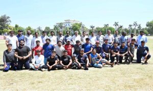 A group photo of Dr. Amir Ali, Dean of Science, and Maheer Ahmad Khan Haral, Director of the Sports Department, with players of the tug-of-war competition on the final match between the Sociology Department and the Sports Science Department at the University of Sargodha's Sports Gala