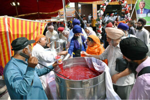 Arrival of Sikh pilgrims in Pakistan through the Wagah Border to attend Vaisakhi Festival and Khalsa Birth Anniversary Celebrations