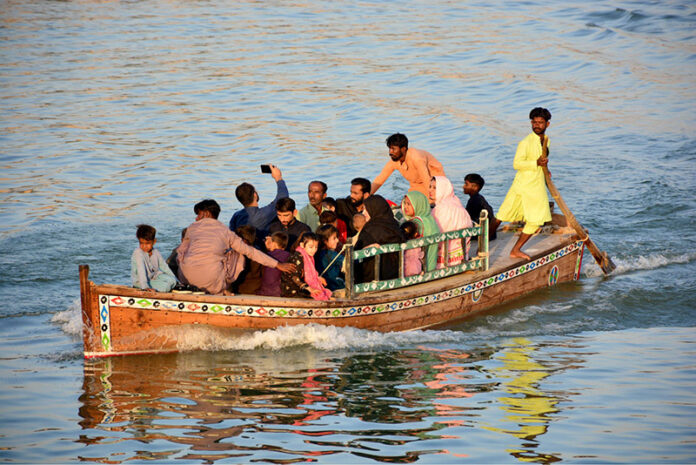 Visitors enjoying boat ride on the 3rd day of Eid-ul-fitr celebrations in River Indus
