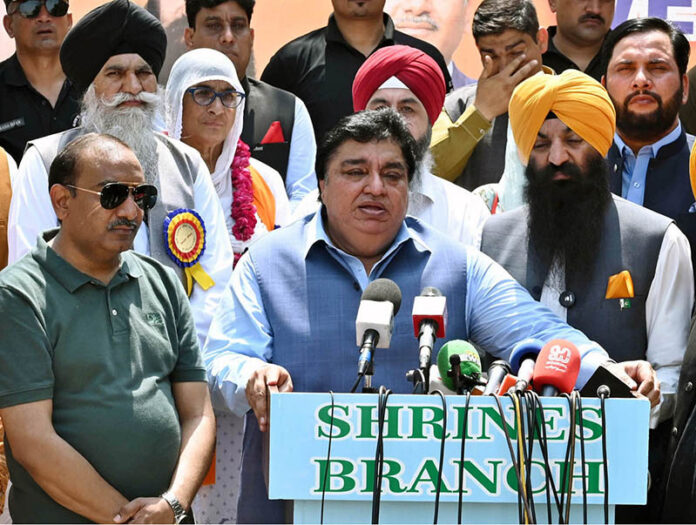 Minister of State for Religious Affairs Khel Das Kohistani along with Sardar Ramesh Singh Arora is talking to the media at Wagah Border