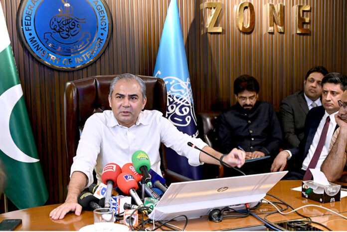 Federal Interior Minister Mohsin Naqvi addressing a press conference at FIA Office Temple Road