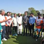 Dutch hockey legend Floris Jan Bovelander provides coaching tips to hockey players during a special training clinic organized by the Khawaja Junaid Hockey Academy (KJHA) at Naseer Bunda Hockey Stadium, Pakistan Sports Complex