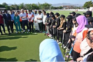 Dutch hockey legend Floris Jan Bovelander provides coaching tips to hockey players during a special training clinic organized by the Khawaja Junaid Hockey Academy (KJHA) at Naseer Bunda Hockey Stadium, Pakistan Sports Complex