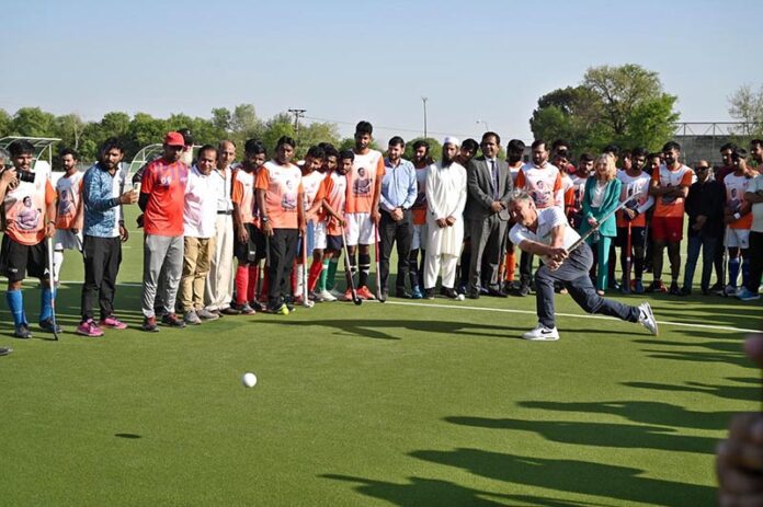 Dutch hockey legend Floris Jan Bovelander provides coaching tips to hockey players during a special training clinic organized by the Khawaja Junaid Hockey Academy (KJHA) at Naseer Bunda Hockey Stadium, Pakistan Sports Complex