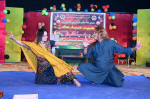 Artists performing on the stage during Eid Function at Shaheed Zulfiqar Ali Bhutto Open Air Theater Arts Council