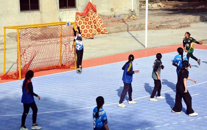Players in action during the 35th National Women's handball trials are being held at the University of Agriculture ground organized by the Punjab Sports Board