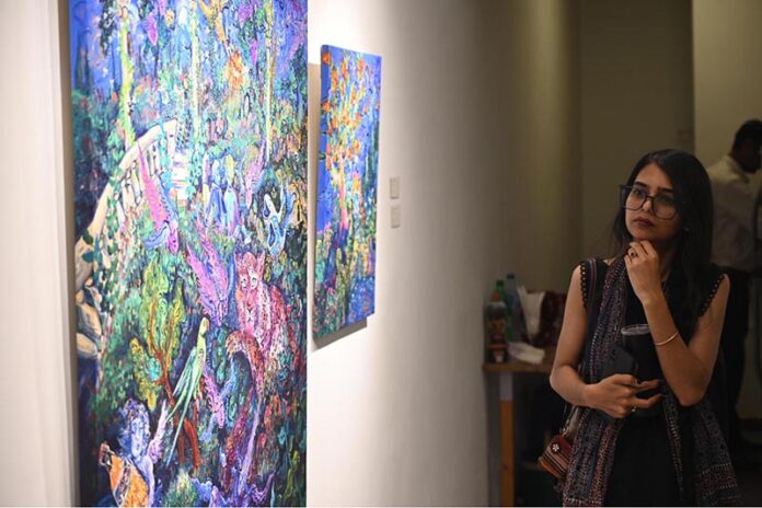 Visitors viewing the photo exhibition 'The Quiet Storm'—a powerful group show featuring seven visionary artists whose works reflect subtle intensity and precision, at Tanzara Gallery, Saidpur Village