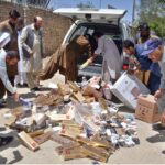 Illegal platinum cigarettes being torched by FBR personnel which was recovered during checking