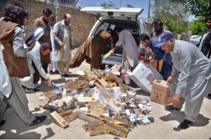 Illegal platinum cigarettes being torched by FBR personnel which was recovered during checking
