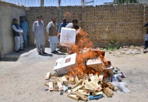 Illegal platinum cigarettes being torched by FBR personnel which was recovered during checking