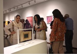 Visitors viewing the photo exhibition 'The Quiet Storm'—a powerful group show featuring seven visionary artists whose works reflect subtle intensity and precision, at Tanzara Gallery, Saidpur Village