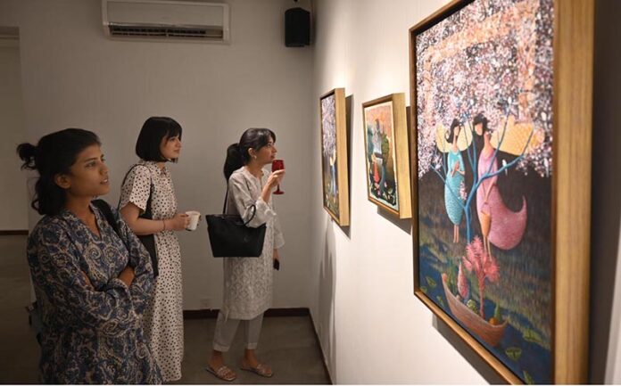 Visitors viewing the photo exhibition 'The Quiet Storm'—a powerful group show featuring seven visionary artists whose works reflect subtle intensity and precision, at Tanzara Gallery, Saidpur Village