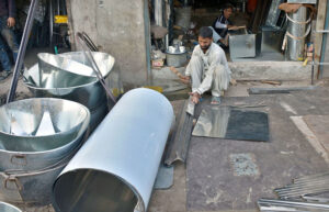 Workers at the trunk market are engaged in the production of silver, iron boxes from metallic iron at their workplace.