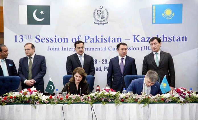 Ahad Cheema, Minister for Economic Affairs witnessing the signing of MoU between Ministry of Information and Kazakhstan’s Ministry of Culture and Information