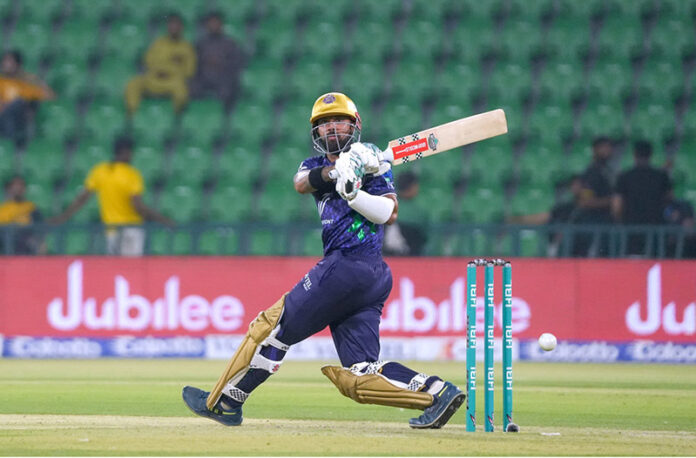 Quetta Gladiators player Saud Shakeel plays shot during the Pakistan Super League PSL-X T20 cricket match between Quetta Gladiators and Karachi Kings at the Gaddafi Cricket Stadium