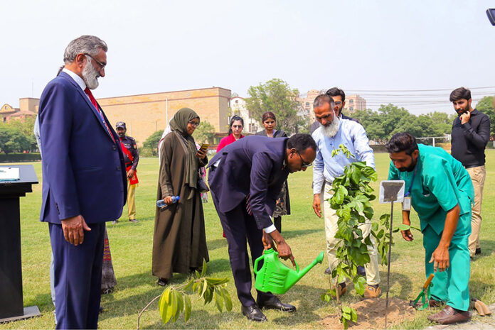 Ambassador of Somalia to Pakistan His Excellency Sheikh Noor Mohammed Hassan is planting a sapling during his visit to The University of Faisalabad (TUF)