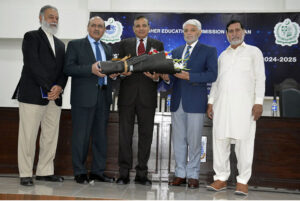Rector UOL Muhammad Ashraf and Rector Lahore Garrison General Haider present bouquets of flowers to the participants participating in the regional round of the Pakistan Universities Debating Championship held at the Quaid-e-Azam Campus of the Institute of Energy and Environmental Engineering, Punjab University at the end of the ceremony
