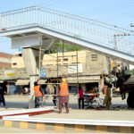 Workers are busy constructing a new pedestrian bridge on Walton Road