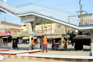 Workers are busy constructing a new pedestrian bridge on Walton Road