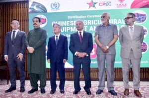 Federal Minister for Food Security and Research, Rana Tanveer Hussain addressing the handing over ceremony of Agricultural machinery arrived in Pakistan under CPEC