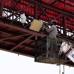Worker busy repairing CCTV cameras at Faisal Avenue
