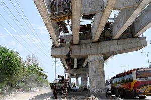 Laborer’s busy making roadside boundary wall at the site of under construction 10th Avenue during development work in Federal Capital