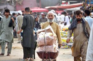 Labourers unloading sacks of onion from a delivery truck at the Islamabad Fruit and Vegetables market as the world celebrates International Labour Day. May 1st, International Workers' Day, commemorates the historic struggles of working people worldwide. In 1884, the Federation of Organized Trades and Labour Unions passed a resolution declaring that eight hours would constitute a legal day's work, effective from May 1, 1886