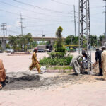 IESCO workers are busy installing electricity pole near IJP Road in the Federal. Capital