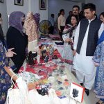 Deputy Commissioner Faisalabad Capt (R) Nadeem Nasir visits a stalls during Art Gala exhibition organized by department of art and design faculty of arts & humanities at Expo Center University of Agriculture Faisalabad(UAF)