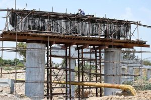 Laborer’s busy making roadside boundary wall at the site of under construction 10th Avenue during development work in Federal Capital