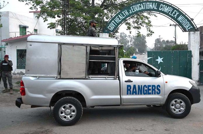 Security officials patrolling outside the Government Health and Educational Complex in Muridke, about 30 kilometers from Lahore, following Indian airstrikes