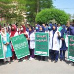 Doctors and paramedical staff of Nishtar Medical University hold a rally carrying National flags and banners to express solidarity with the Pakistan Army, paying tribute to its role in defending the nation and ensuring peace
