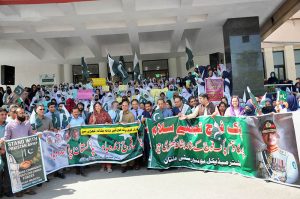 Doctors and paramedical staff of Nishtar Medical University hold a rally carrying National flags and banners to express solidarity with the Pakistan Army, paying tribute to its role in defending the nation and ensuring peace