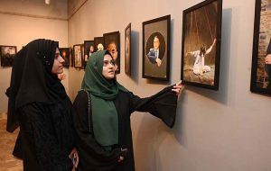 A student keenly observes a display at the “Photojournalism in the Digital Era” exhibition organized by the Mask Communication Department of the University of Sargodha